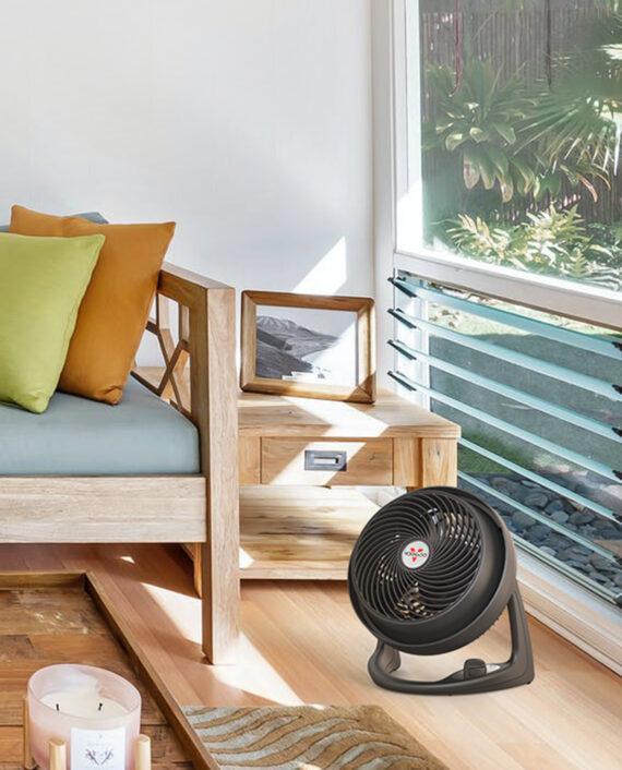 610B Medium Air Circulator by a brightly lit window on a hardwood floor.